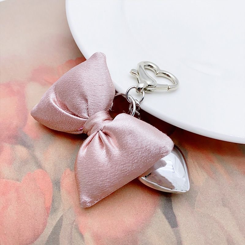 Women Fashion Simple Champagne Powder Three-Dimensional Bow Silver Metal Heart-Shaped Keychain