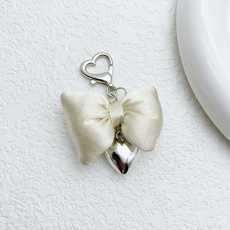 Women Fashion Simple Champagne Powder Three-Dimensional Bow Silver Metal Heart-Shaped Keychain